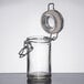 An American Metalcraft miniature glass apothecary jar with a metal lid.