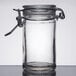 An American Metalcraft miniature glass apothecary jar with a metal lid and handle.
