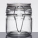 An American Metalcraft miniature glass apothecary jar with a metal hinge.