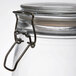 An American Metalcraft glass apothecary jar with a metal clip lid.