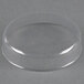 An American Metalcraft clear plastic dome on a grey surface.