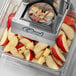 An Edlund Titan Max-Cut manual dicer on top of sliced apples.