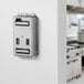 A stainless steel Edlund Titan Max-Cut Manual 1/2" Dicer wall mount outlet.