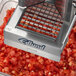 An Edlund Titan Max-Cut Manual Dicer with a piece of food in it.