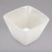 An American Metalcraft white square porcelain sauce cup.