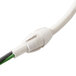 A close-up of a white Waring cord with green wires attached.
