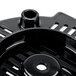 A close-up of black plastic bottom housing for a Waring blender with holes.