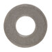 A close-up of a round metal Waring washer with a hole in it.