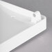 A close-up of a white rectangular Bunn drip tray with a handle.
