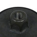 A close-up of a black metal nut with a screw on it.