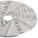 A circular metal Waring shredder disc with spikes on it.