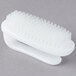A white Waring juice extractor cleaning brush with bristles.