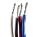 A close up of a black, blue, and red wire on a white background.