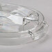 A clear plastic container with a handle and a white chopping lid.