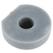 A gray rubber round plug with a hole in it.
