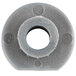 A gray round rubber plug with a hole in it.