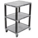 A grey Luxor plastic utility cart with three grey plastic shelves and black metal legs.