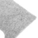 A close-up of a gray felt pad.