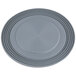 A grey plastic plate with a circular design and a hole in the center.