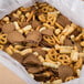 A white paper box of Deluxe Snak-ens Mix with a pretzel and cracker on the label.
