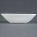 A CAC MAJ-B6 white European bone china square bowl on a grey surface.