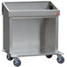 A stainless steel Steril-Sil silverware dispensing cart with wheels.
