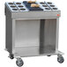 A stainless steel Steril-Sil silverware dispensing cart with black covers on the trays.