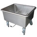 A large stainless steel Steril-Sil silverware soak sink with wheels.