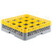 A yellow and grey plastic Noble Products glass rack extender with 16 compartments.