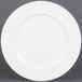 A CAC Majesty European bone china round plate with a small rim on a white background.