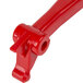 A red plastic Cecilware faucet handle with a hole.