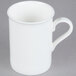A close-up of a CAC Majesty European bone china mug with a handle.