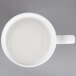 A white CAC Majesty European Bone China mug with a white rim and handle.