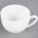 A white CAC bone china cup with a handle.