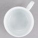 A CAC porcelain cup with a handle on a white background.