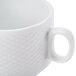 A close-up of a white porcelain CAC Stacking Cup with an embossed design.