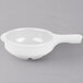 A white plastic bowl with a handle.