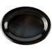 A black oval platter with a textured surface.