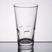 A close-up of a Libbey stackable cooler glass on a table.