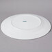 A white CAC Harmony porcelain plate.