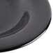 A close up of a textured black GET bowl.