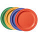 A case of 24 round melamine plates with different colors.