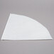 A white triangle shaped paper grease filter.