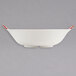 A white GET Bella Fresco bowl with red handles.