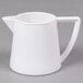A white GET plastic creamer pitcher with a handle.