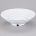A white GET Milano melamine bowl with a spiral design on a gray surface.