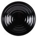 A black circular bowl with a spiral design.