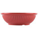 A close-up of a red GET Geneva bowl with a rippled design.