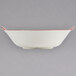 A white rectangular GET Bella Fresco bowl with red trim.