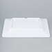 A white rectangular melamine plate with a white background.